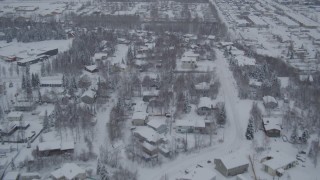 AK0001_1644 - Aerial stock footage of 4K aerial  video flying over snowy neighborhoods and mobile home parks, Anchorage, Alaska