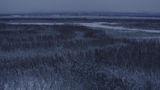 AK0001_1679 - 4K aerial stock footage Downtown Anchorage seen from snowy Point MacKenzie at twilight, Alaska
