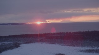 AK0001_1683 - 4K aerial stock footage the twilight and clouds seen from snow covered Point MacKenzie, Alaska