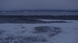 AK0001_1686 - 4K aerial stock footage Downtown Anchorage across the inlet, seen from snowy Point MacKenzie at twilight, Alaska