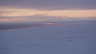 AK0001_1691 - 4K aerial stock footage twilight lit clouds over snow covered Point MacKenzie and Cook Inlet, Alaska
