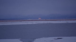 AK0001_1709 - 4K aerial stock footage approaching Downtown Anchorage from Point MacKenzie, Alaska, twilight