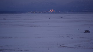 AK0001_1712 - 4K aerial stock footage tilt to reveal Downtown Anchorage, seen from Point MacKenzie, Alaska, twilight