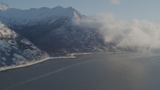 AK0001_1739 - 4K aerial stock footage flying over the Turnagain Arm of the Cook Inlet, Alaska in snow
