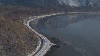 AK0001_1742 - 4K aerial stock footage Seward Highway on the Turnagain Arm, Alaska in snow