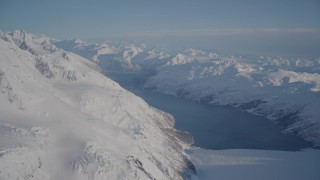 AK0001_1781 - 4K aerial stock footage Harriman Fjord and Glacier surrounded by snowy Chugach Mountains, Alaska