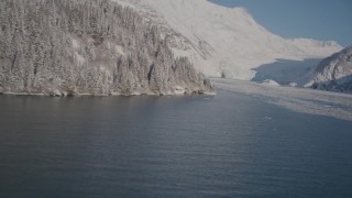 AK0001_1793 - 4K aerial stock footage fly over Harriman Fjord, snowy glacier spilling down Chugach Mountains, Alaska