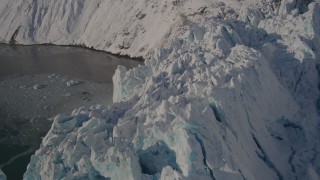 AK0001_1800 - 4K aerial stock footage the jagged edge of a snow covered glacier, Harriman Fjord, Alaska