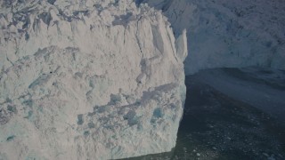 AK0001_1803 - 4K aerial stock footage the jagged edge of the snow covered glacier at end of Harriman Fjord, Alaska