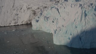 AK0001_1805 - 4K aerial stock footage the edge of a snow covered glacier on the Harriman Fjord, Alaska