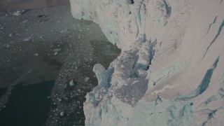 AK0001_1806 - 4K aerial stock footage the edge of a snow covered glacier on the Harriman Fjord, Alaska