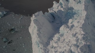 AK0001_1808 - 4K aerial stock footage bird's eye view of the edge and rough surface of snow covered glacier on Harriman Fjord, Alaska