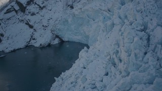 AK0001_1823 - 4K aerial stock footage the edge of a snow covered glacier on Harriman Fjord, Alaska