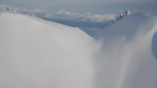 AK0001_1876 - 4K aerial stock footage fly over snowy summit reveal Hummer Bay, Chugach Mountains, Port Wells, Alaska