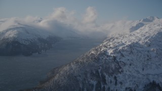 AK0001_1907 - 4K aerial stock footage Passage Canal surrounded by snowy Chugach Mountains, Alaska