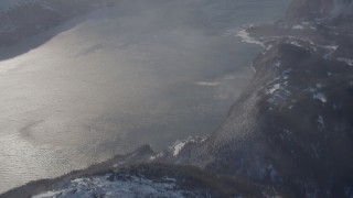 AK0001_1912 - 4K aerial stock footage the windblown Passage Canal near a snowy, hilly valley, Alaska