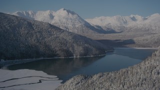 AK0001_1922 - 4K stock footage aerial video descend toward Carmen Lake, snowy Chugach Mountains, Alaska