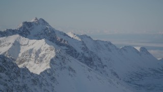 AK0001_1986 - 4K stock footage aerial video snowy Chugach Mountains, Knik Arm of the Cook inlet, Alaska