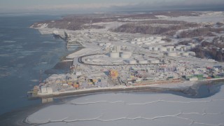 AK0001_2015 - 4K aerial stock footage a snow covered oil refinery next to the Port of Anchorage, Alaska