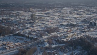 AK0001_2025 - 4K aerial stock footage panning across snow covered residential neighborhoods, Anchorage, Alaska