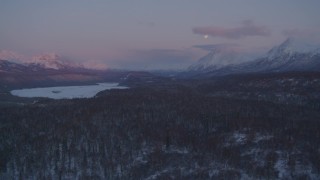AK0001_2106 - 4K aerial stock footage snowy Matanuska River Valley, Chugach Mountains, Alaska, twilight