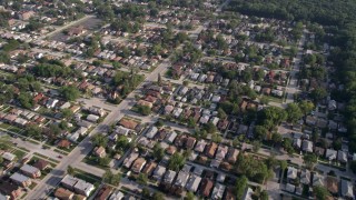 AX0001_004 - 4.8K aerial stock footage reverse view of residential neighborhood with trees, Calumet City, Illinois