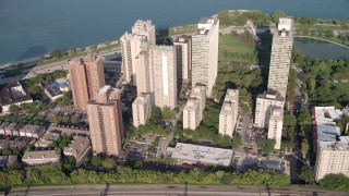 AX0001_012 - 4.8K aerial stock footage passing a group of lakefront apartment buildings in Hyde Park, Chicago, Illinois