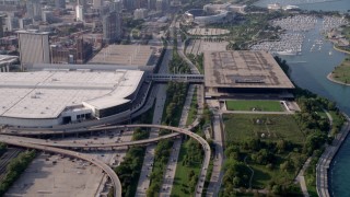 AX0001_018 - 4.8K aerial stock footage tilt from Highway 41, reveal downtown skyline, McCormick Place, Soldier Field, Chicago, Illinois