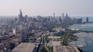 AX0001_019 - 4.8K aerial stock footage following Highway 41 toward Soldier Field and Downtown Chicago skyline, on a hazy day, Illinois