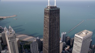 AX0001_031 - 4.8K aerial stock footage tracking John Hancock Tower, tilt down Downtown Chicago, Illinois