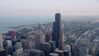 AX0001_033 - Aerial stock footage of 4.8K aeria video  tilt from the Chicago River to reveal Willis Tower in Downtown Chicago, Illinois