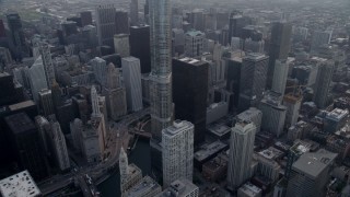 AX0001_040 - 4.8K aerial stock footage tilting from Chicago River to reveal Trump Tower Chicago and Willis Tower in distance, Downtown Chicago, Illinois
