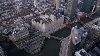 AX0001_046 - 4.8K aerial stock footage pan from Merchandise Mart across the Chicago River, Downtown Chicago, Illinois