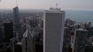 AX0001_052 - 4.8K aerial stock footage flying by Aon Center, revealing Trump International and John Hancock Center in Downtown Chicago, Illinois