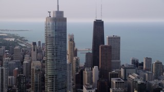 AX0001_053 - 4.8K aerial stock footage of John Hancock Center, Trump International Hotel and Tower, Downtown Chicago, Illinois