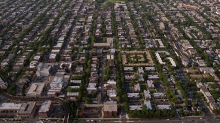 AX0001_057 - 4.8K aerial stock footage video tilt from homes in the North part of Chicago to reveal apartment buildings, on a hazy day, Chicago, Illinois