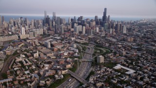 AX0001_064 - 4.8K stock footage aerial video tilt from streets by Interstate 90 and 94, revealing downtown skyline, Downtown Chicago, Illinois