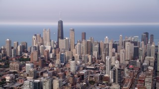 AX0001_067 - 4.8K aerial stock footage panning across Downtown Chicago skyscrapers, on a hazy day, Illinois