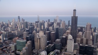 AX0001_070 - 4.8K aerial stock footage Downtown Chicago skyscrapers and Willis Tower on a hazy day, Illinois