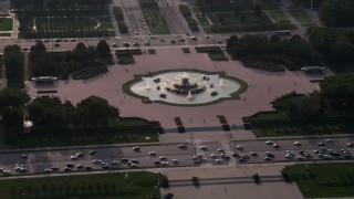AX0001_096 - 4.8K aerial stock footage of boats on Lake Michigan, revealing Buckingham Fountain in Grant Park, Downtown Chicago, Illinois