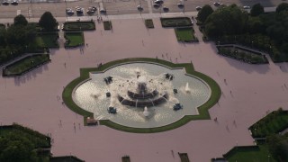 AX0001_097 - 4.8K aerial stock footage tilting down on Buckingham Fountain in Grant Park, Chicago, Illinois