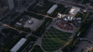 AX0001_104 - 4.8K aerial stock footage of the Cloud Gate sculpture at AT&T Park and Jay Pritzker Pavilion, Downtown Chicago, Illinois