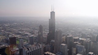 AX0001_106 - 4.8K aerial stock footage of Willis Tower on a hazy day, Downtown Chicago, Illinois