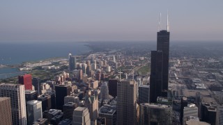 AX0001_108 - 4.8K aerial stock footage flyby Willis Tower with Lake Michigan in the background, Downtown Chicago, Illinois