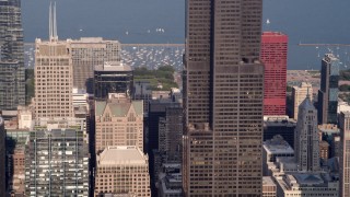 AX0001_111 - 4.8K aerial stock footage tilting up side of Willis Tower, Downtown Chicago, Illinois