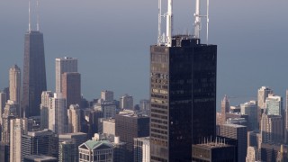 AX0001_113 - 4.8K aerial stock footage fly by the Willis Tower Skydeck on a hazy day, Downtown Chicago, Illinois