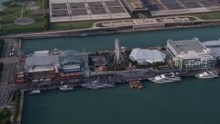 AX0001_122 - 4.8K aerial stock footage of Ferris Wheel on Navy Pier in Chicago, Illinois