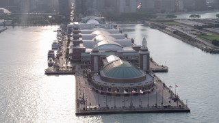 AX0001_125 - 4.8K aerial stock footage orbiting the end of Navy Pier on a hazy day, Chicago, Illinois