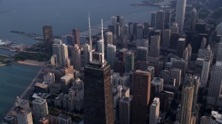 AX0001_128 - 4.8K aerial stock footage of the top of John Hancock Center and downtown Chicago skyscrapers, Illinois