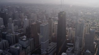 AX0001_131 - 4.8K aerial stock footage of John Hancock Center in Downtown Chicago, on a hazy day, Illinois